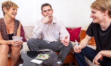 This cougar does two toyboys on her couch
