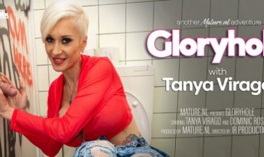 Big breasted MILF Tanya Virago loves to suck cocks through a gloryhole