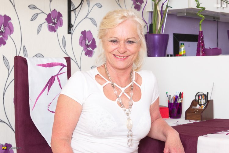 Horny mature lady getting ready to play with her toy