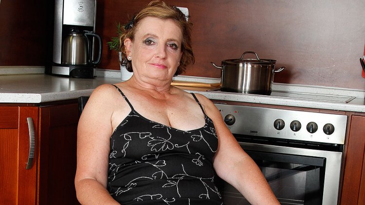 Naughty mature lady playing in the kitchen