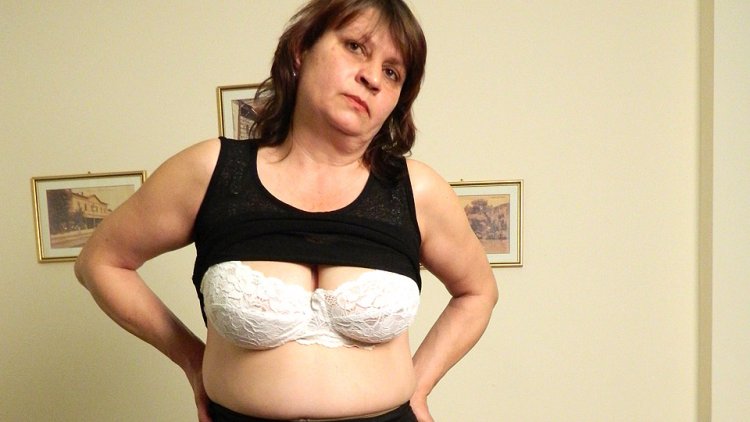 Horny mature slut masturbating on the couch