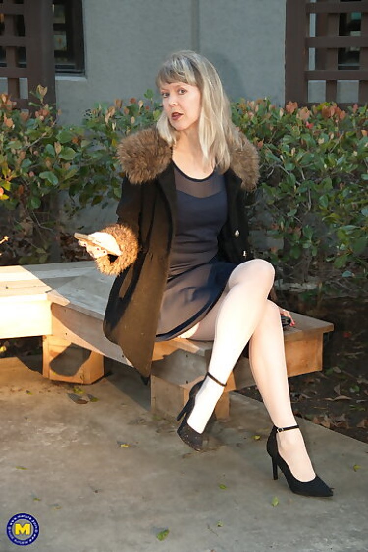 Naughty mature lady with high heels and pantyhose playing with herself