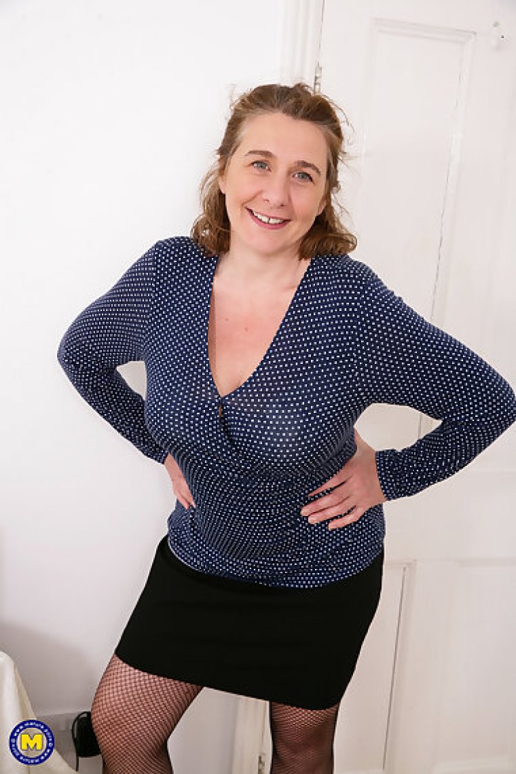 Naughty british housewife showing off her big tits