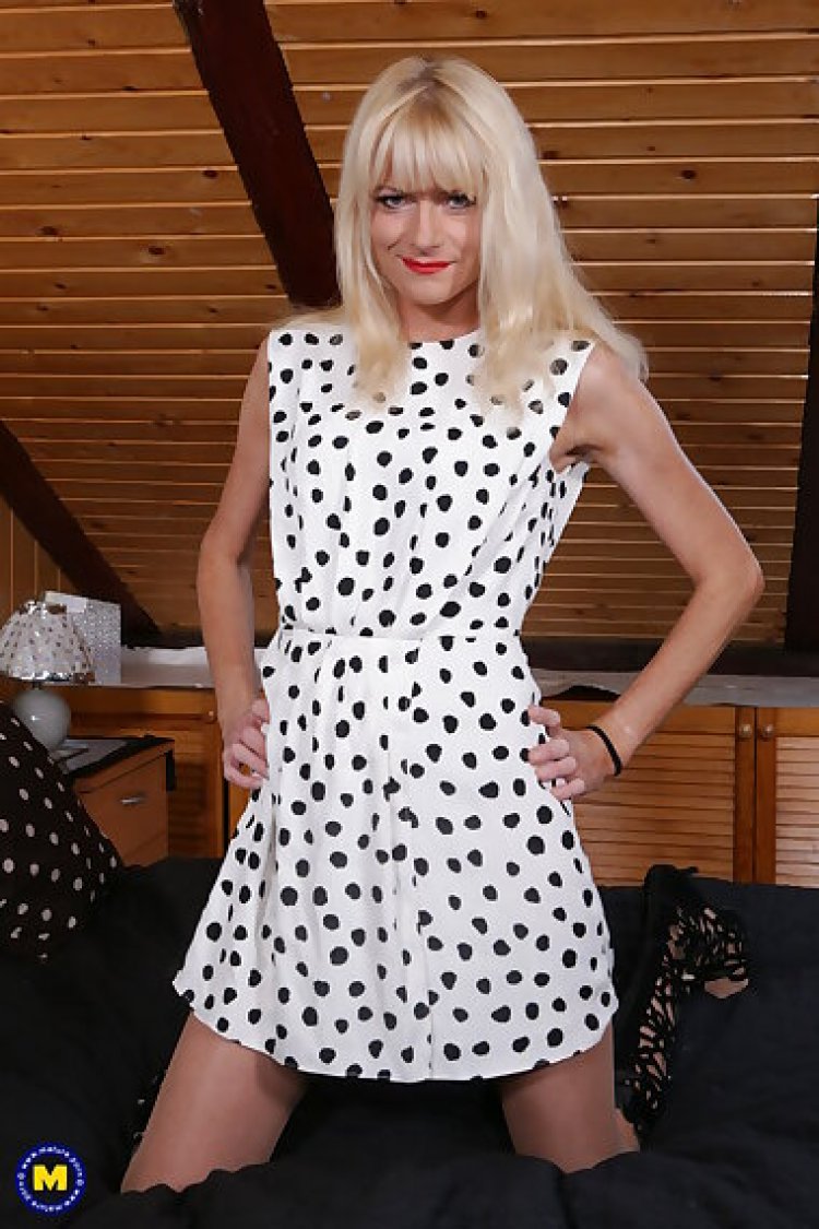 Naughty blonde milf playing with her shaved pussy