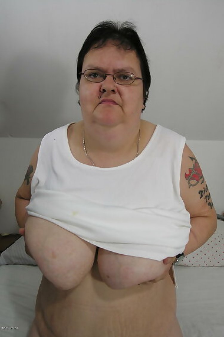 Big mama playing with her toy and tits