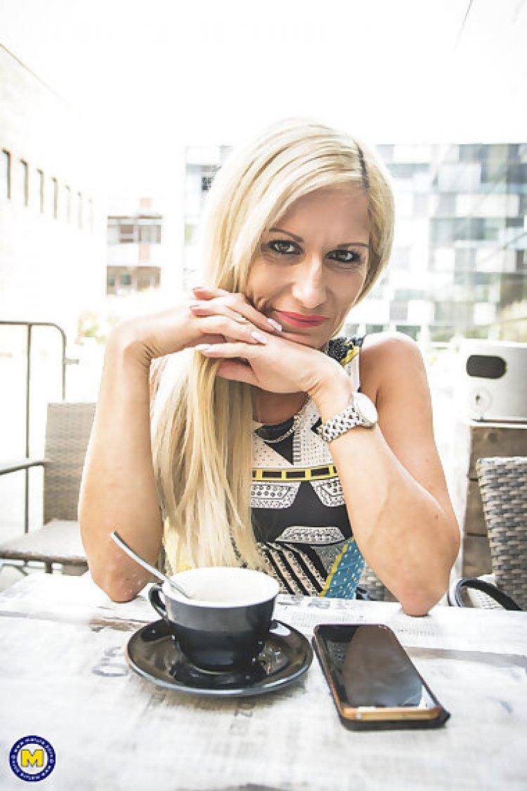 Steamy hot milf playing with her shaved pussy