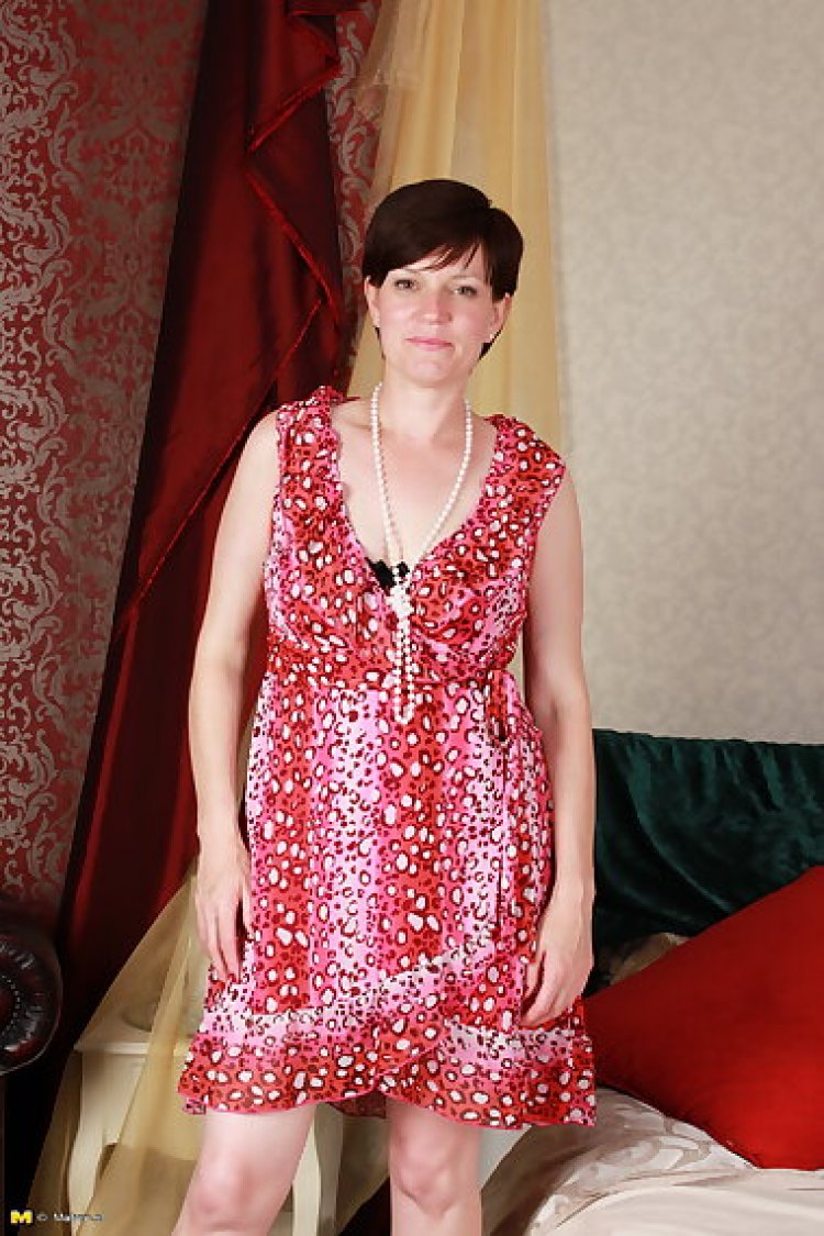 Horny housewife fucking in her bed