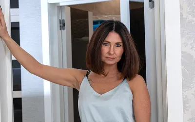 Hot MILF playing with her shaved pussy