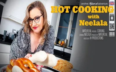 Kitchen time with mature Neelala while she's getting hot and steamy