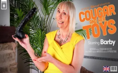 Mature Barby loves playing with her toys