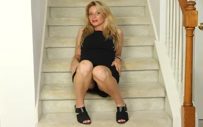 Naughty American MILF Playing with Her Pussy on the Stairs - Mature.nl