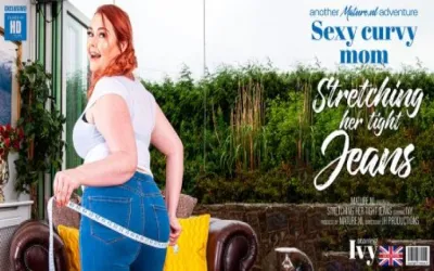 Sexy curvy mom stretching her tight jeans